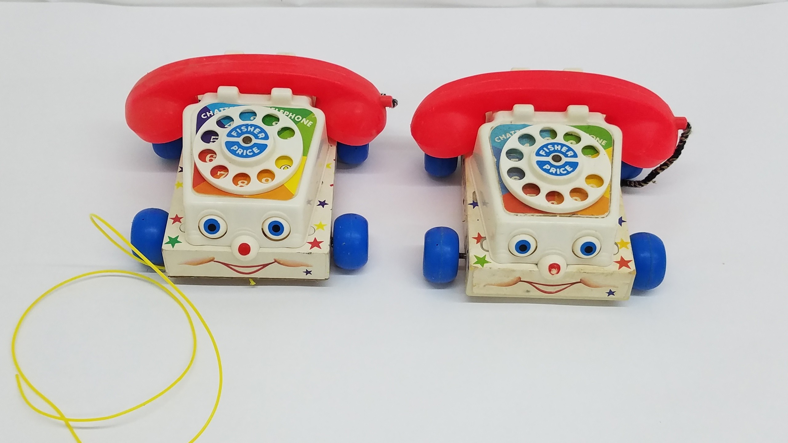 2 Fischer Price 747 Chatter Telephones 1 Wood and 1 Plastic Base