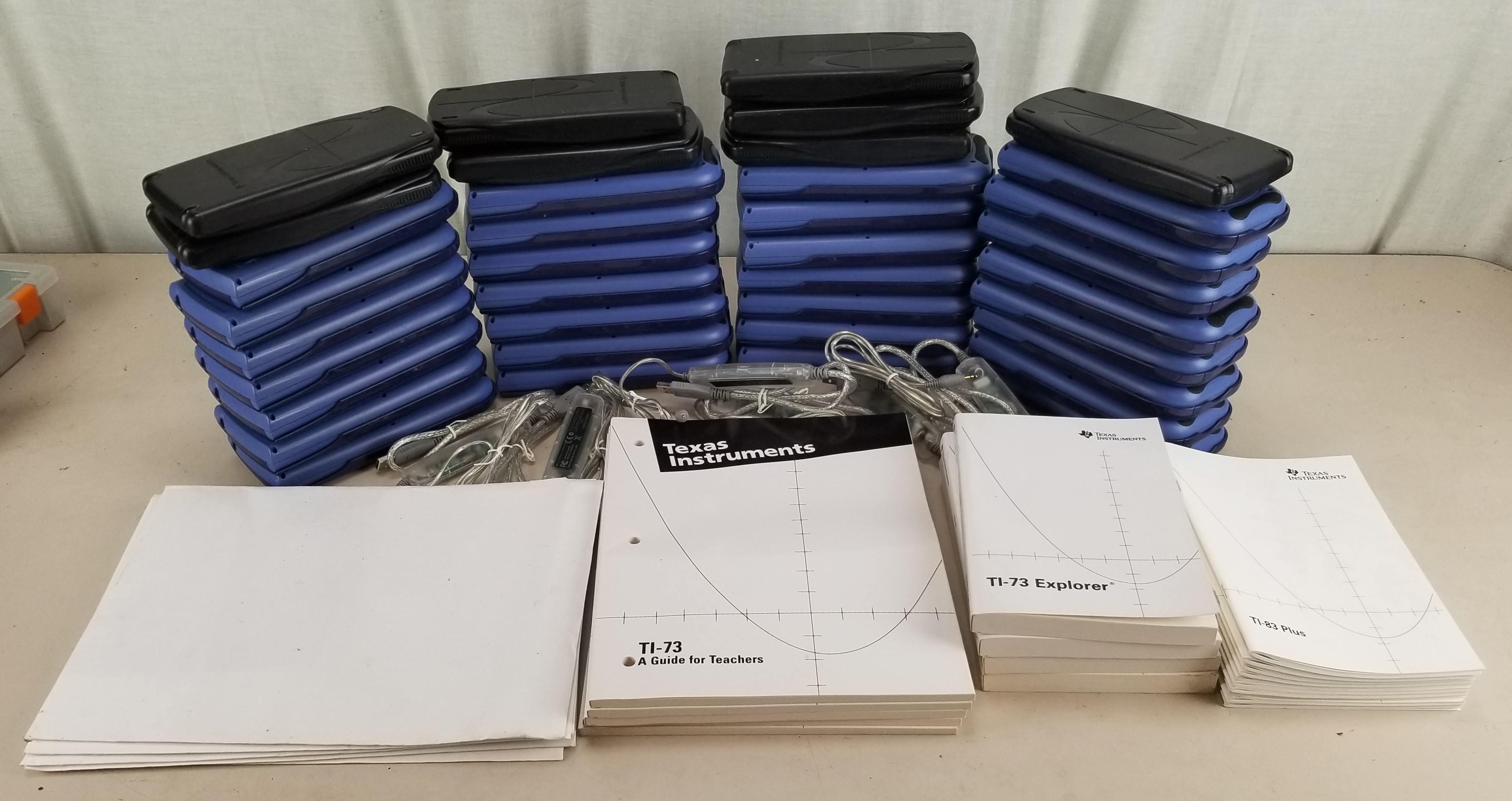 Lot of 43 TI 73 Explorer (29) / 83 Plus (8) / Graph Link USB Cables (6) with Some Accessories